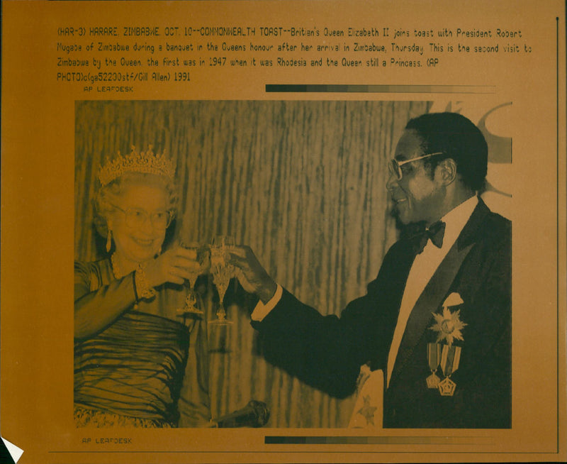 Britain's Queen Elizabeth II joins toast with President Robert Mugabe - Vintage Photograph