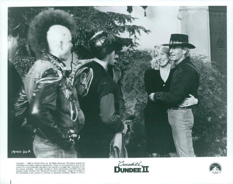 Linda Kozlowski and Paul Hogan in the movie "Crocodile Dundee II" - Vintage Photograph