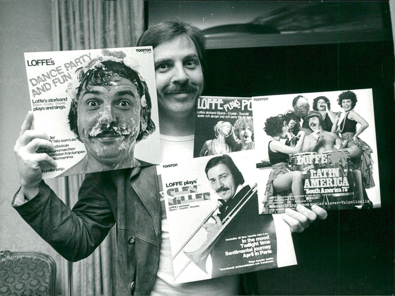 Janne Carlsson with four of his music LP's - Vintage Photograph