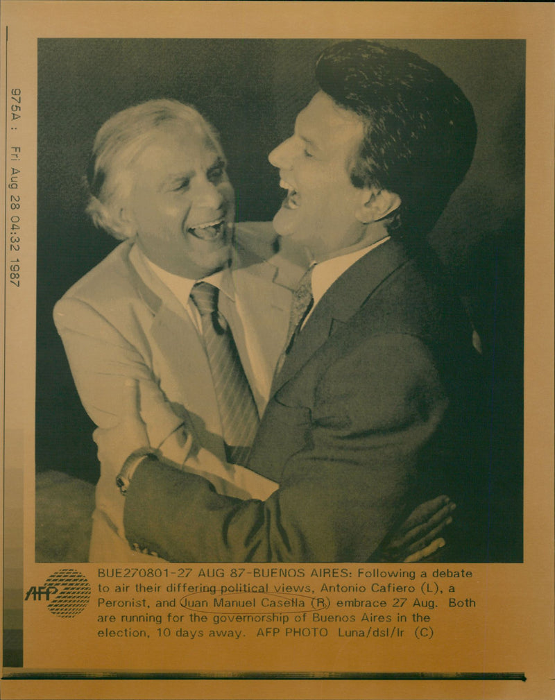 Antonio Cafiero and Juan Manuel Casella embrace after a political debate - Vintage Photograph