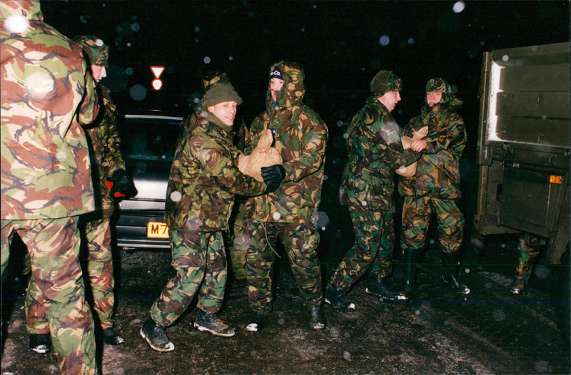 Military personnel helping those affected in Brundall Floods. - Vintage Photograph