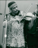 A man using musical instruments. - Vintage Photograph