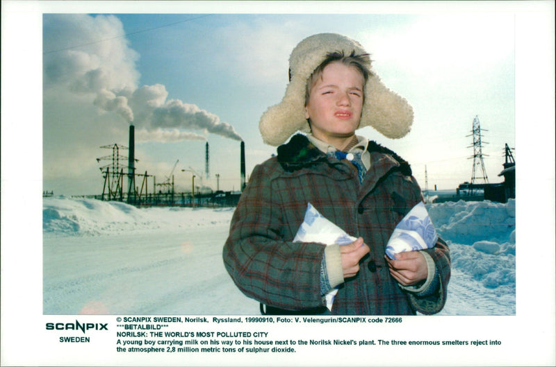 Russia Environmental Issues. Norilsk - one of the world's most polluted cities. A boy near the nickel factory - Vintage Photograph